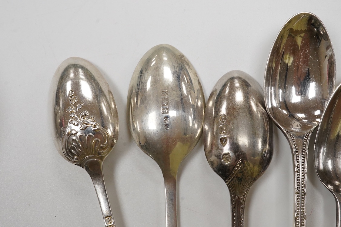 A collection of silver and white metal to include a 19th century Indian dressing table pot and cover chased with flowers, a three piece silver condiment set by Mappin and Webb with associated condiment spoon, three cased